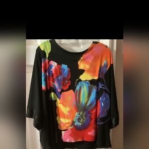 A Frank Lyman design blouse, polyester color black, orange and some blue's